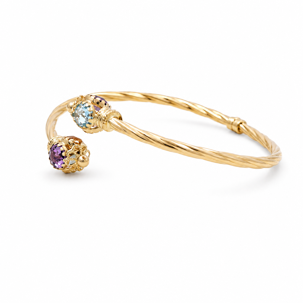 Brazalete semisólido torcido de oro amarillo 14K con zirconia azul y morada / Peso: 6.7 GR / BKC851